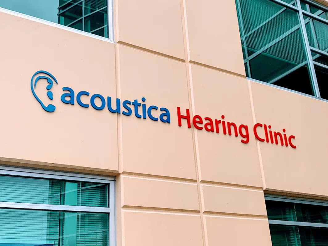 Sign Company Vancouver installing metal and acrylic business signs